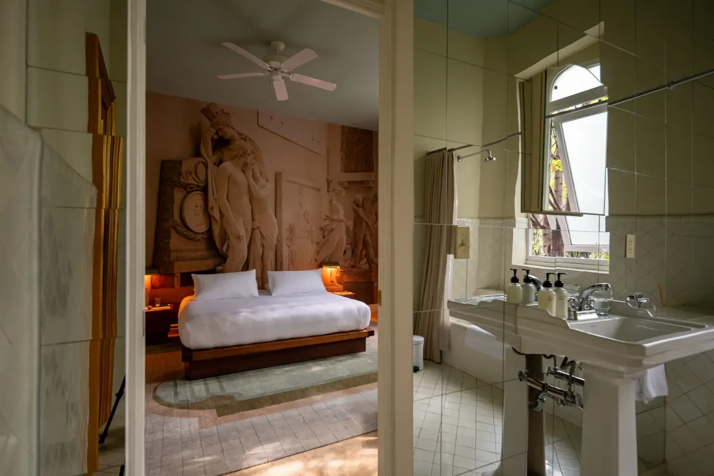 A guest room and bath at Casa Bosques Pension